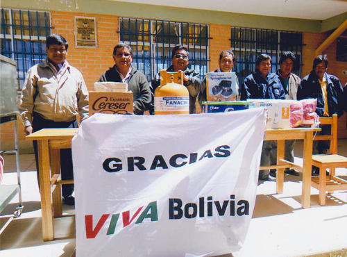 Professors, teachers and parents with new breadmaking equipment.